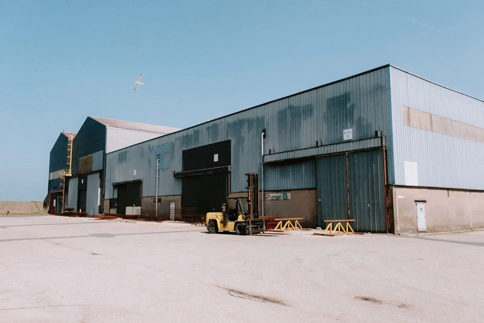 Forklift operating outside a warehouse loading bay